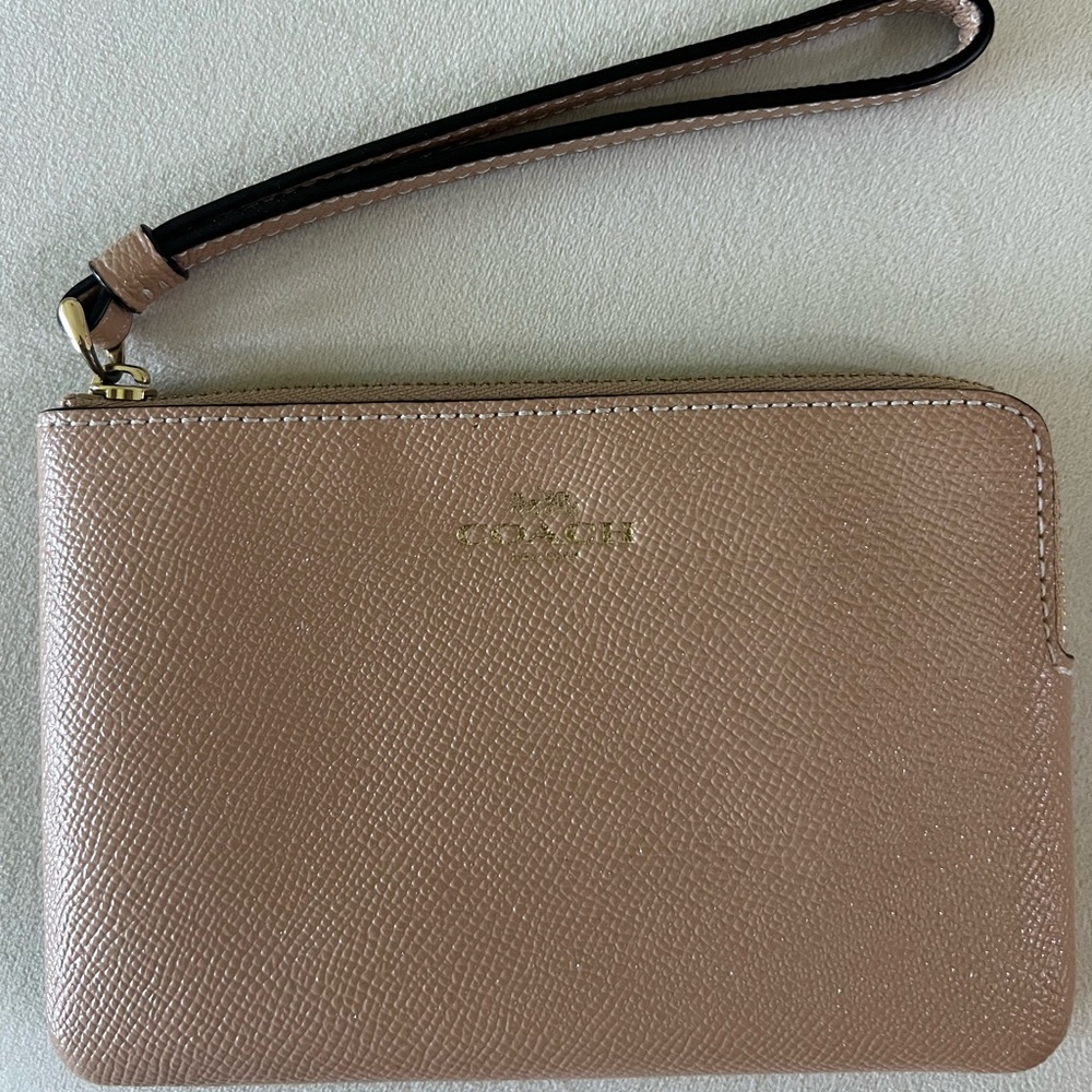Coach corner zip wristlet in gold/taupe color